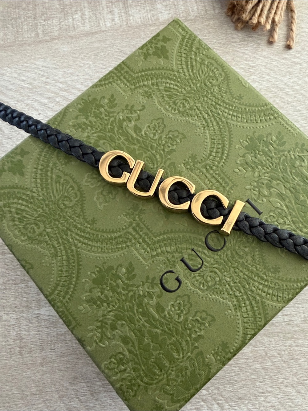 Gucci Black Braided Leather Belt with Gold Logo Letters